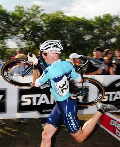 Shannon Skerritt (Vanilla Bicycles) flying over some barriers.