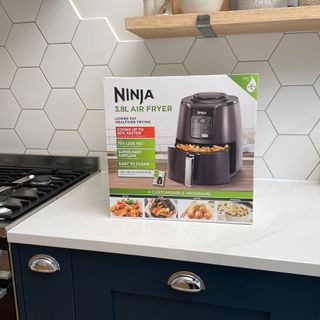 Ninja AF100UK Air Fryer box on a kitchen counter