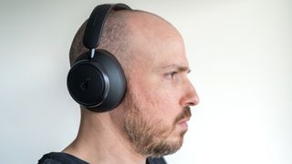 Wearing the Anker Soundcore Space Q45 headphones.