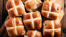 hot cross buns on a wooden countertop