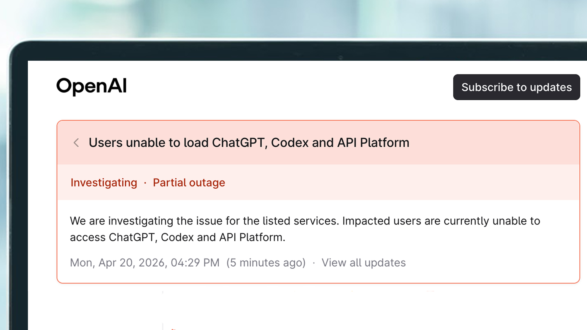A laptop screen showing a message on OpenAI's status page during an outage