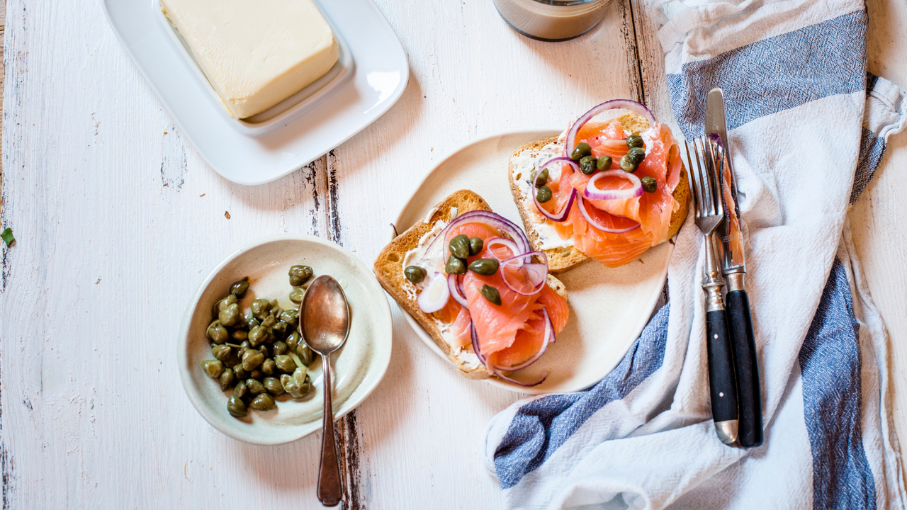 Toast with smoked salmon on table