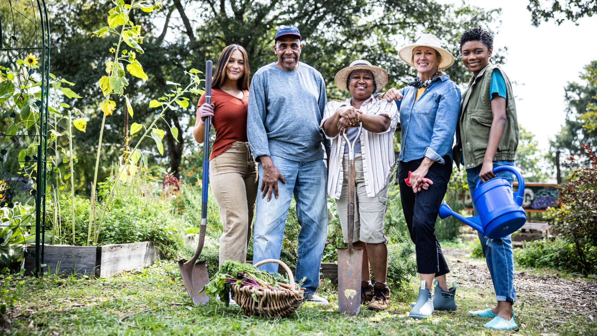 volunteers in front of community garden