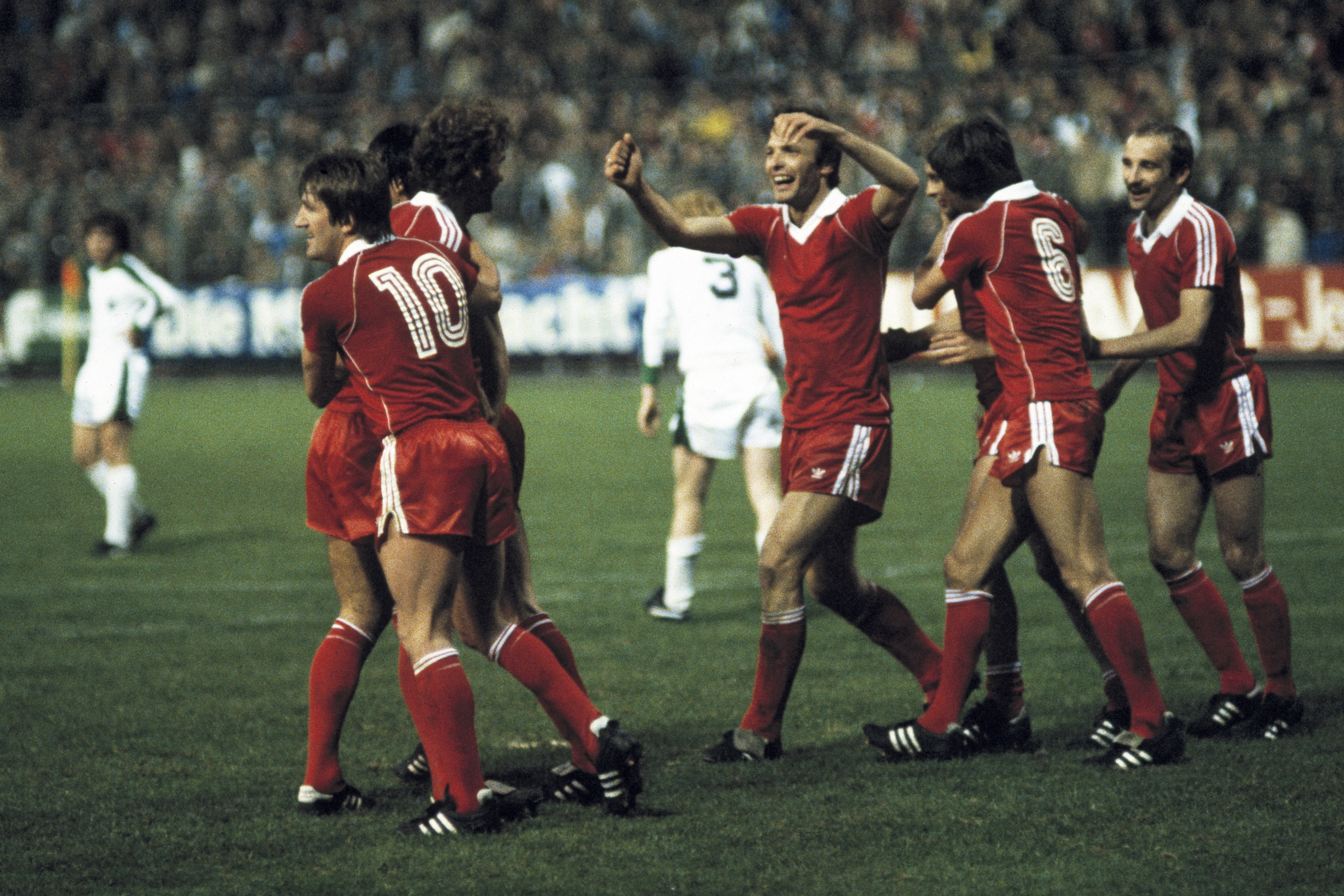 Eintracht Frankfurt players celebrate a goal against Borussia Mönchengladbach in the first leg of the 1980 UEFA Cup final.