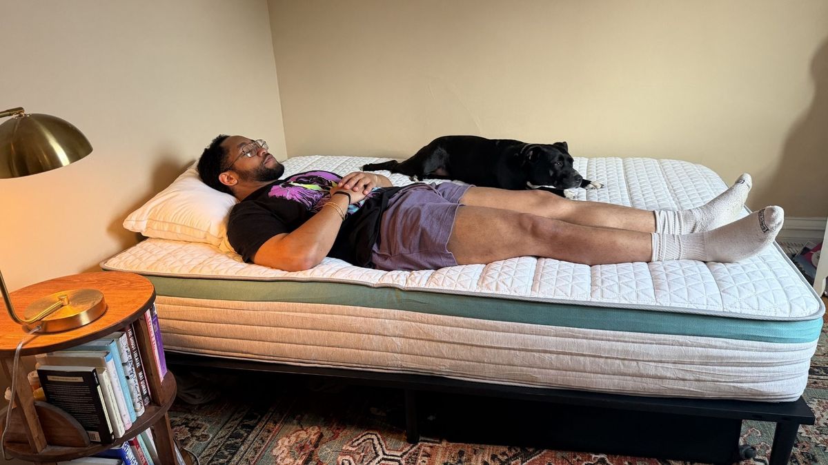 The gallery shows a man and a dog lying on the Helix Sunset mattress with their eyes closed