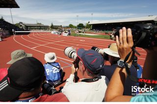 Photographers prepare to shoot the 100m hurdles at the 2011 USA Outdoor Track & Field Championship. Photo by Donald Gruener