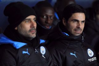 Manchester City manager Pep Guardiola with then assistant Mikel Arteta (right)