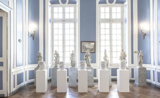 Room with multiple sculptures in