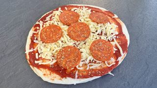 Air fryer pizza loaded with pepperoni