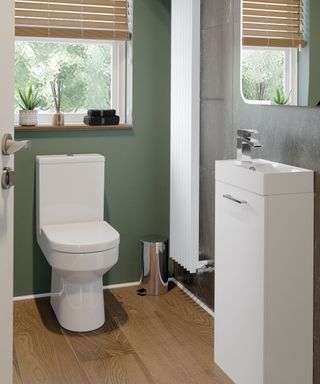 Small bathroom with super slim vanity unit on wall and slim WC