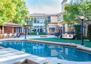 exterior of house with swimming pool and trees