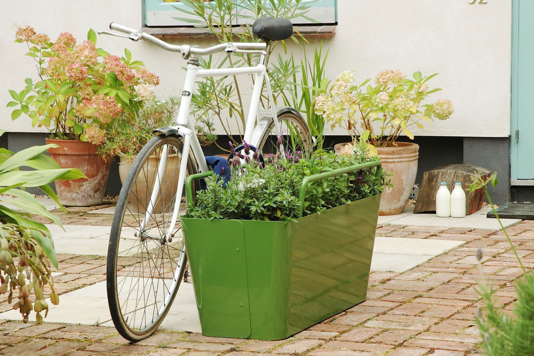 a bike attached to a planter designed to be antitheft