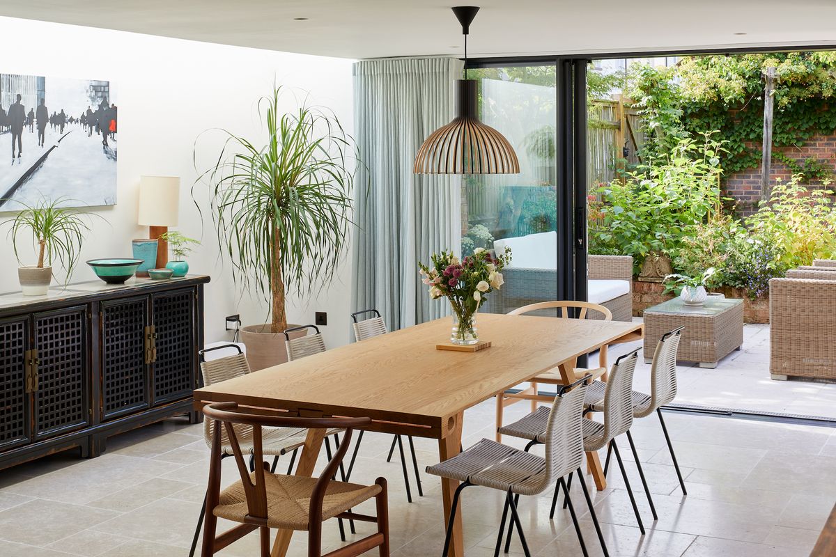 wood dining table in extension with side rooflight