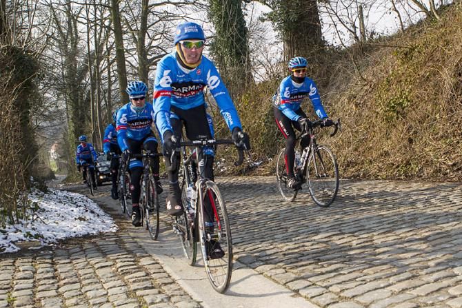 Johan Vansummeren leads his Garmin-Sharp teammates on the cobbled Taaienberg climb.