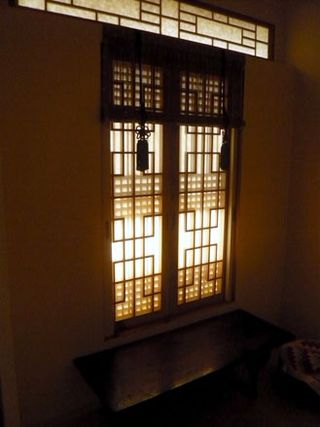 ﻿A traditional wood and paper window in a hanok