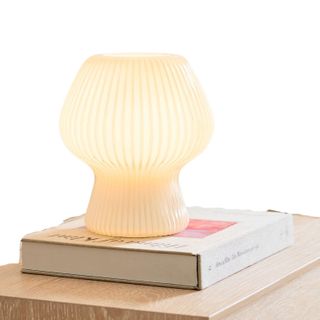 Table lamp on top of book