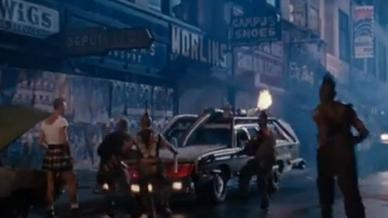 A souped up vehicle crowded around by thugs in Double Dragon