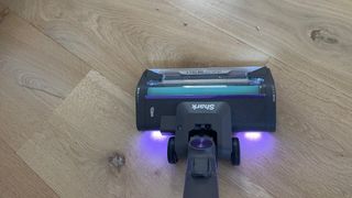 Shark PowerDetect Clean & Empty Cordless Vacuum lit up floorhead