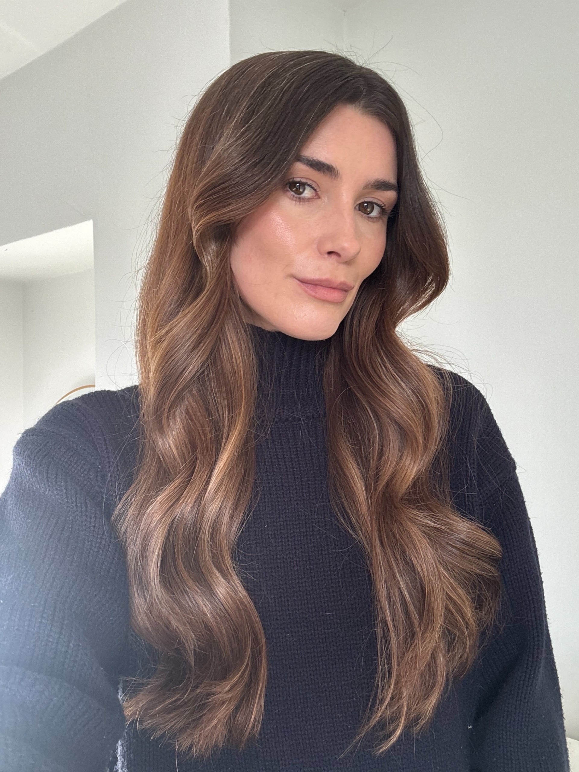 A photo of beauty editor Eleanor Vousden with curled hair