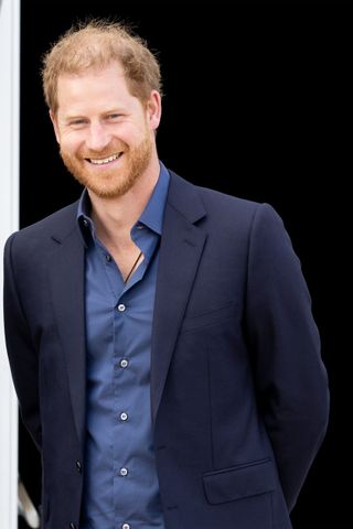 Prince Harry smiles at the camera