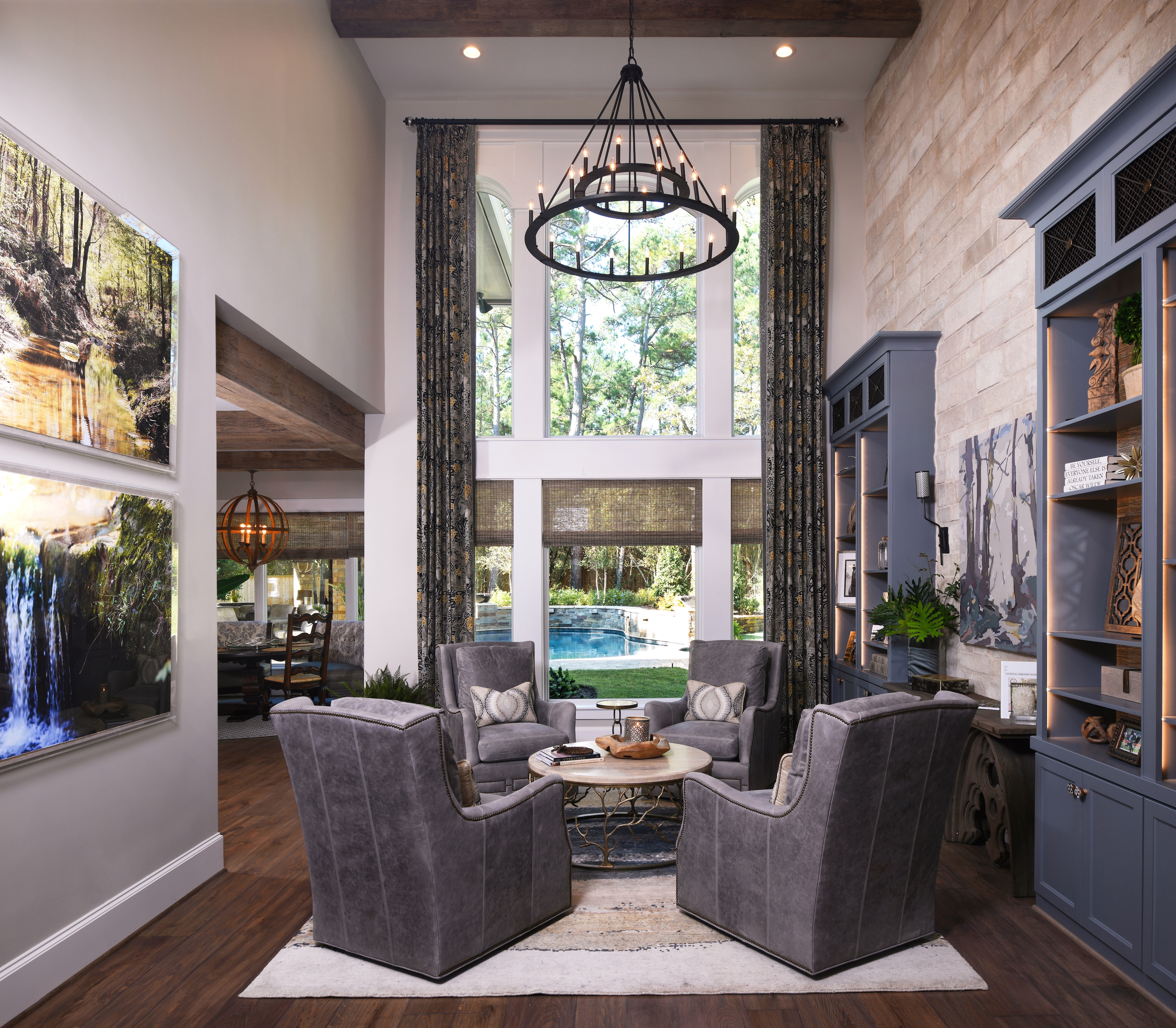 farmhouse living room with double height window dressed with curtains and blinds