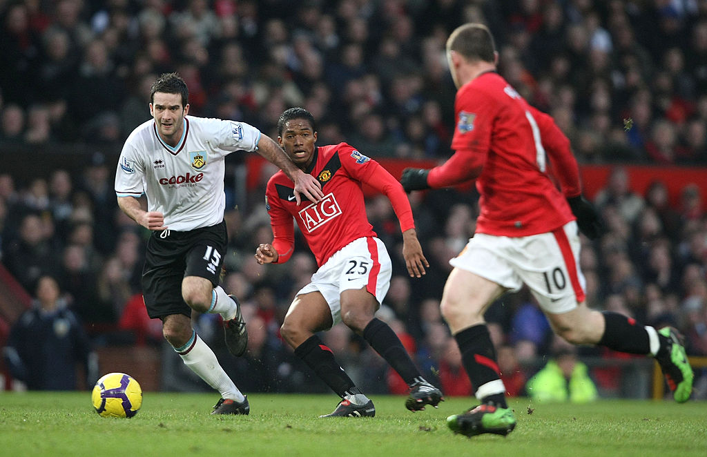 Antonio Valencia of Manchester United clashes with David Edgar of Burnley during the FA Barclays Premier League match between Manchester United and Burnley at Old Trafford on January 16 2010 in Manchester, England.