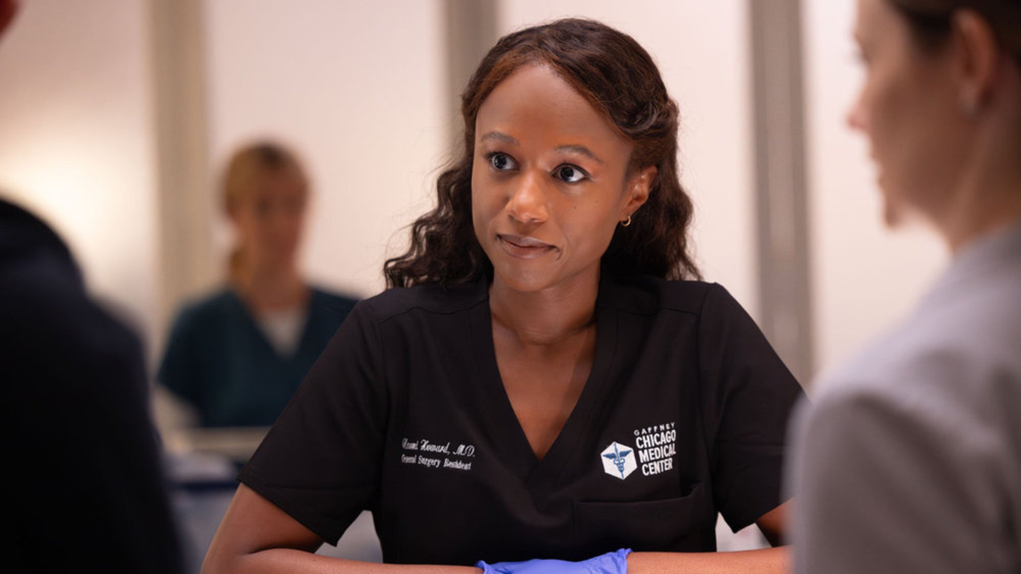 Dr. Naomi Howard leaning against a counter on Chicago Med.