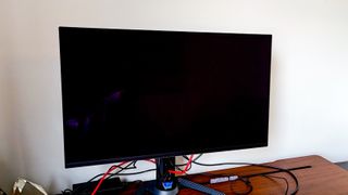 Powered-off Gigabyte Aorus FO32U2P monitor on a desk