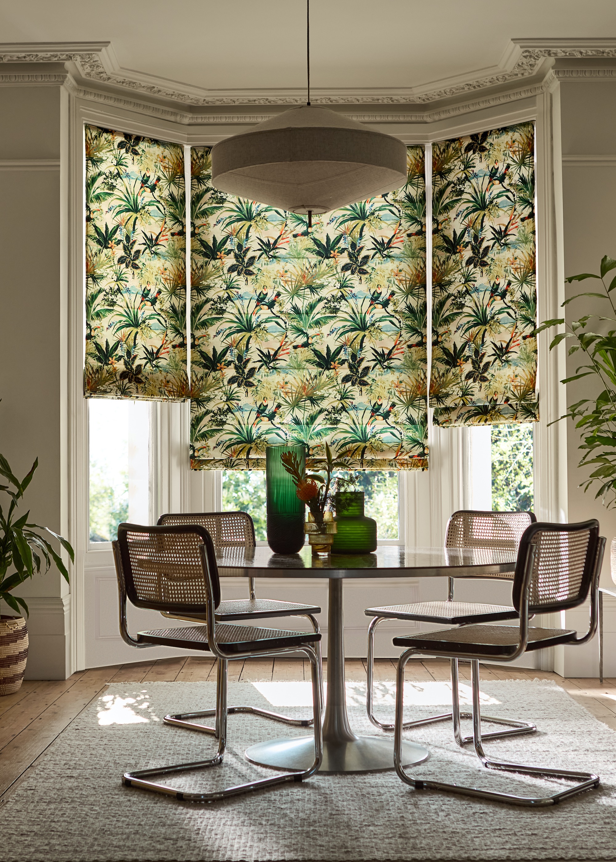 dining table with bay window and three blinds