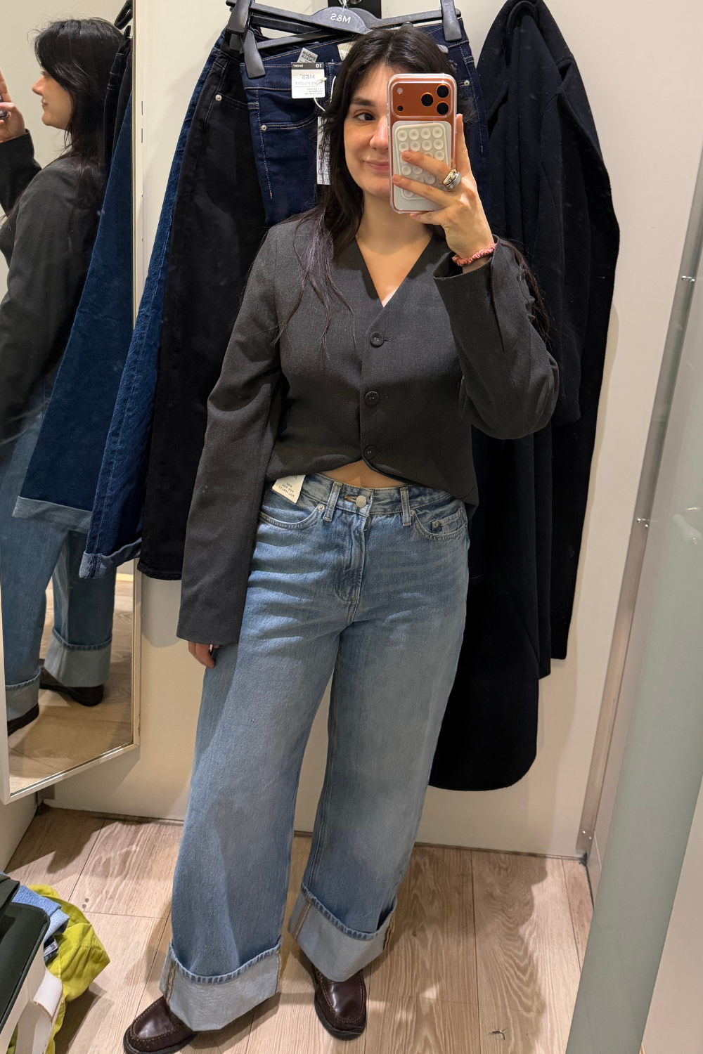Sofia wearing wide-leg jeans