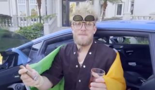 Jake Paul with Irish flag and a cigar