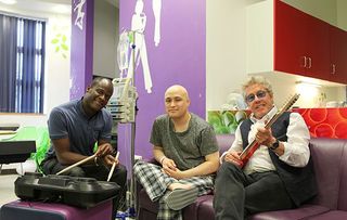 Teenagers Vs Cancer: Roger Daltrey joins Tim for a music therapy session with Kwaku Tieku (L)