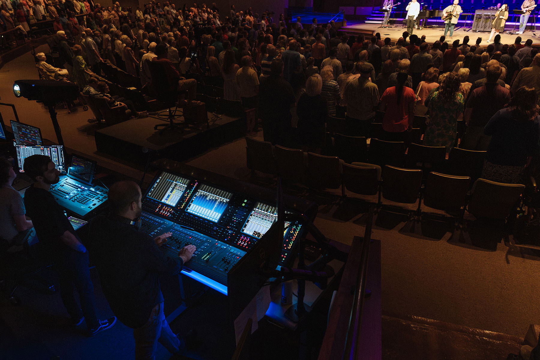 IPS installed a full audio ecosystem for the church, dimly lit here for a choral event, that included DiGiCo Quantum consoles, Fourier Audio transform.engines, and a KLANG:konductor paired with 16 KLANG:kontrollers