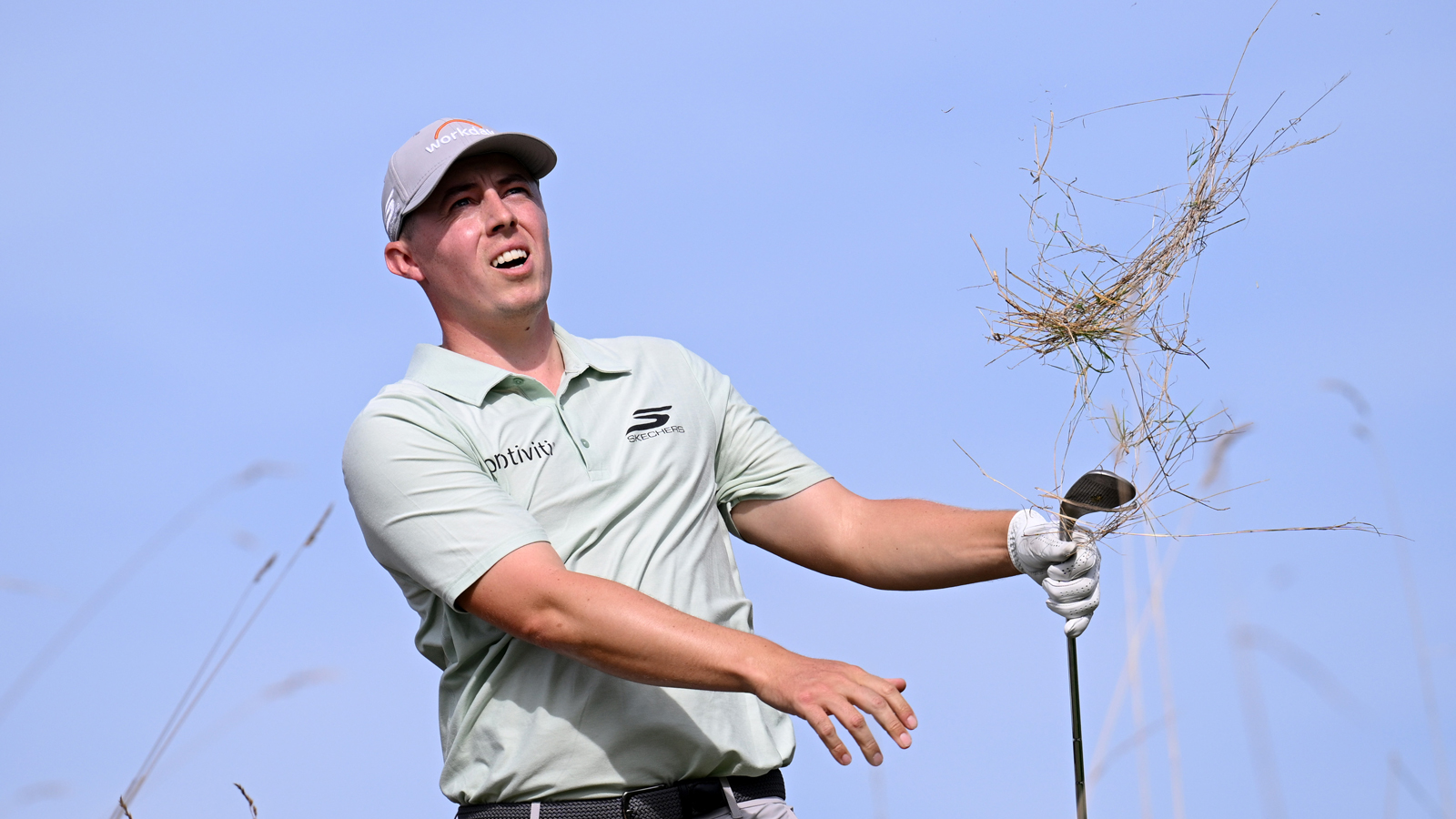 Matt Fitzpatrick hits a shot from the rough