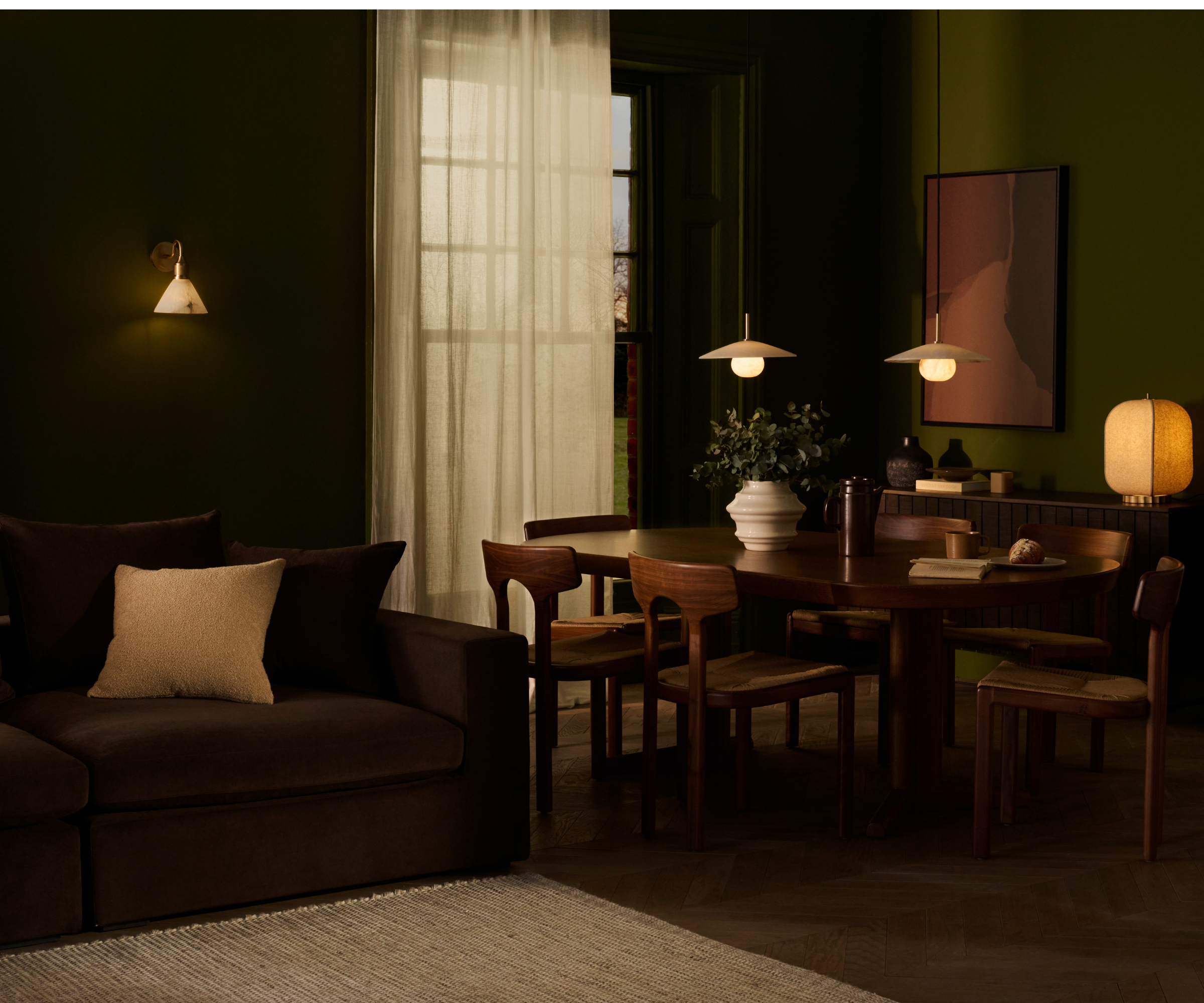 Dark living room diner with layered lighting