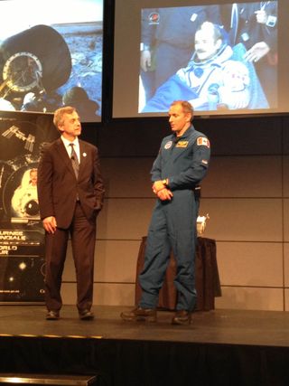 Former astronaut Robert Thirsk (left) and astronaut trainee David Saint-Jacques describe the Expedition 35 landing for tweetup attendees at Canadian Space Agency headquarters near Montreal.