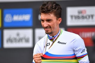 LEUVEN BELGIUM SEPTEMBER 26 Gold medalist Julian Alaphilippe of France celebrates winning during the medal ceremony after the 94th UCI Road World Championships 2021 Men Elite Road Race a 2683km race from Antwerp to Leuven flanders2021 on September 26 2021 in Leuven Belgium Photo by Luc ClaessenGetty Images