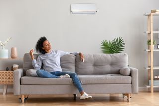 Air purifiers for allergies: Image of woman at home