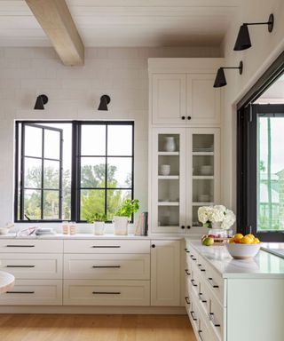 Herlong Architecture and Interiors white kitchen with black hardware photograph Julia Lynn