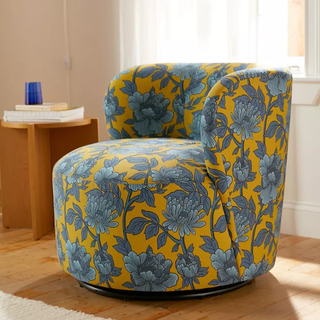 blue and yellow patterned floral swivel barrel accent chair