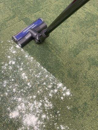 Dyson V12 Detect Slim vacuuming flour and sugar on carpet