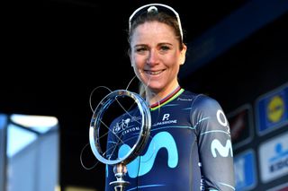 NINOVE BELGIUM FEBRUARY 26 Annemiek Van Vleuten of Netherlands and Movistar Team Women poses at podium with race trophy as winner after the 17th Omloop Het Nieuwsblad 2022 Womens Race a 128km race from Ghent to Ninove OHN22 FlandersClassic WorldTour on February 26 2022 in Ninove Belgium Photo by Luc ClaessenGetty Images