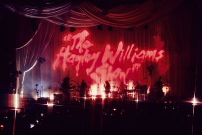 bands on stage in pink light