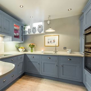 kitchen with frame on wall and grey cabinets