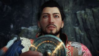 Nioh 3 character holding shining jade medallion