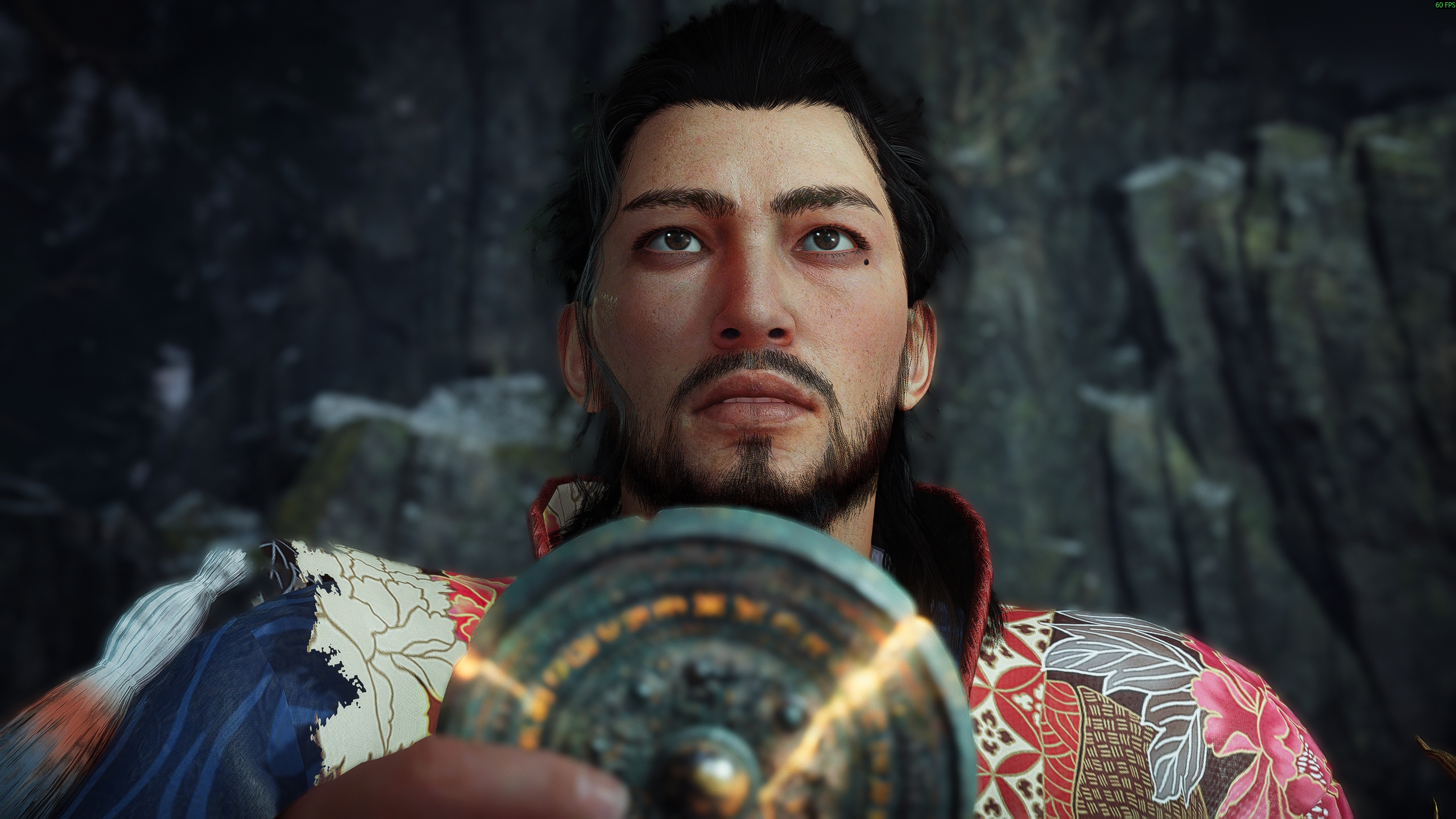 Nioh 3 character holding shining jade medallion