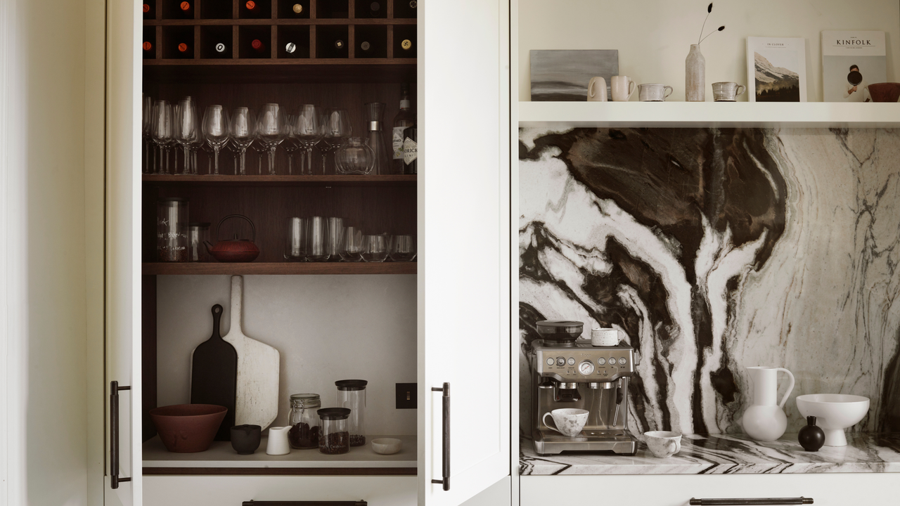 a marble kitchen with a double pocket door breakfast station