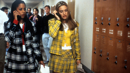 Stacey Dash and Alicia Silverstone walking and talking on their mobile phones in a scene from the film 'Clueless', 1995.