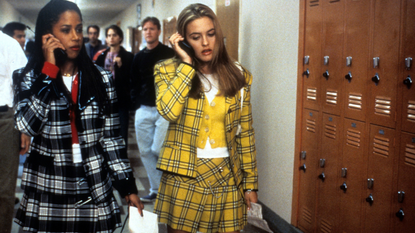 Stacey Dash and Alicia Silverstone walking and talking on their mobile phones in a scene from the film &#039;Clueless&#039;, 1995.