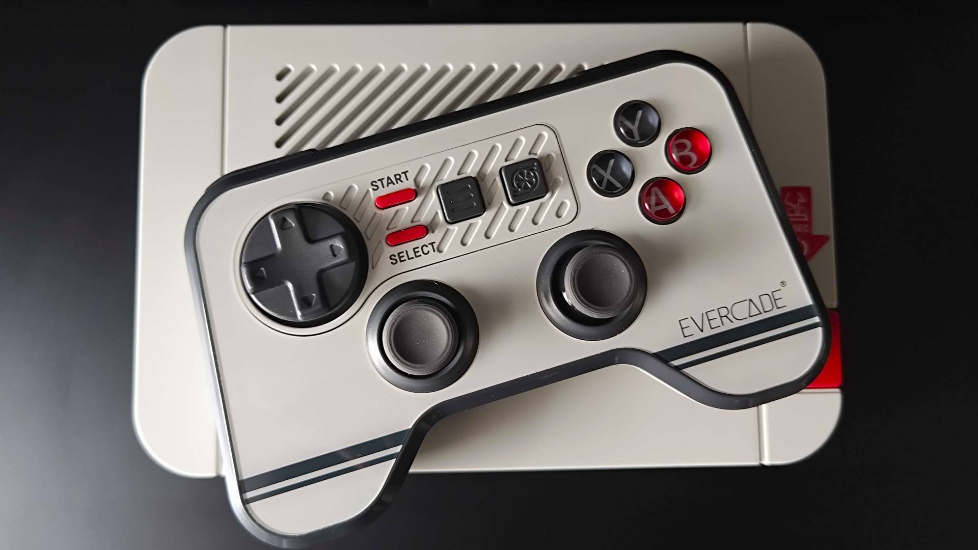 Evercade Dual Thumbstick Wireless Controller sitting on top of VS-R console.